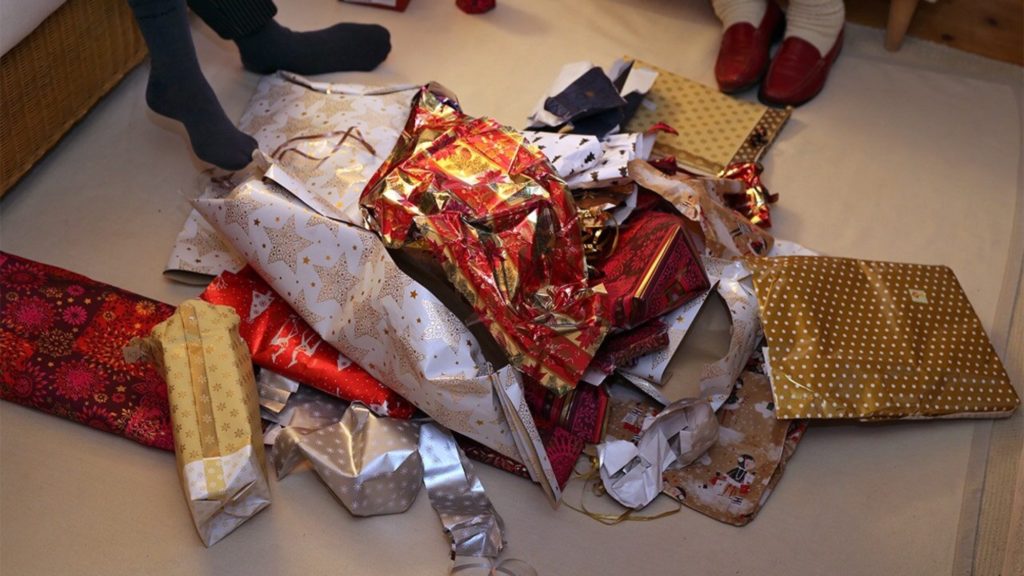 Wrapping paper discarded for recycling with tape still in tact